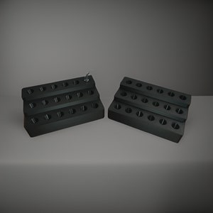 May include: Two black plastic organizers with multiple compartments for storing small items. Each organizer has three rows of compartments.