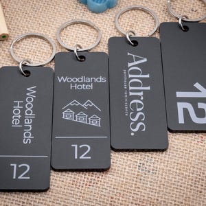 Hotel key chain - personalized key holder with motel name, logo and room number - key tag for hostels and B&Bs - custom keyring.