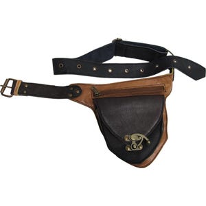 May include: A brown and black leather fanny pack with a belt. The fanny pack has a zippered pocket and a flap with a metal clasp. The belt is black with metal grommets and a buckle.