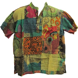 May include: A short-sleeved shirt with a patchwork design. The shirt is made of a variety of fabrics and features a colorful pattern of circles, swirls, and geometric shapes. The shirt has a mandarin collar and a button closure at the neck.