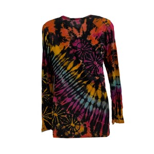 May include: A long-sleeved tie-dye shirt in a vibrant array of colors, including orange, yellow, pink, and blue, set against a black background. The shirt features a round neckline and a relaxed fit, perfect for casual wear.