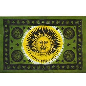 May include: A green tapestry with a yellow and black sun and moon design. The sun has a human face and is surrounded by stars. The moon is a crescent shape.