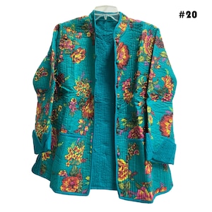 May include: A teal blue quilted jacket with a floral print. The jacket has a mandarin collar and a front zipper closure. #20