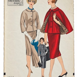 May include: A Vogue Couturier Design printed pattern 1027 envelope featuring illustrations of three outfits: a beige suit with a blue necklace, a red cape-style jacket over a red skirt with a leopard print lining, and a grey suit with a black handbag.