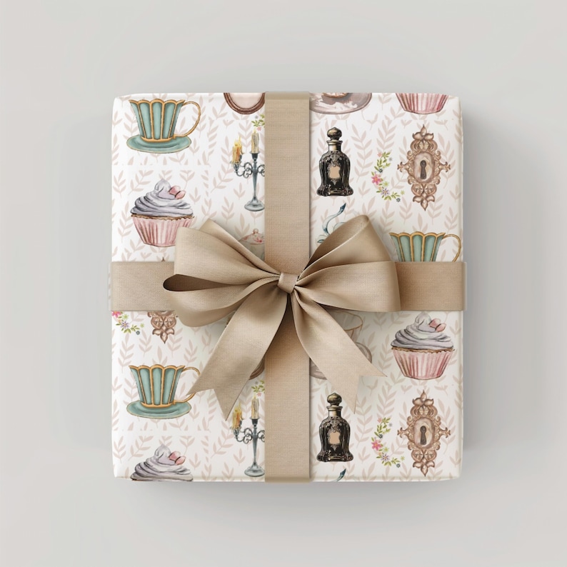 vintage tea party wrapping paper featuring teacups, cupcakes, perfume bottles and keys, wrapped with taupe ribbon, ideal for elegant gifts