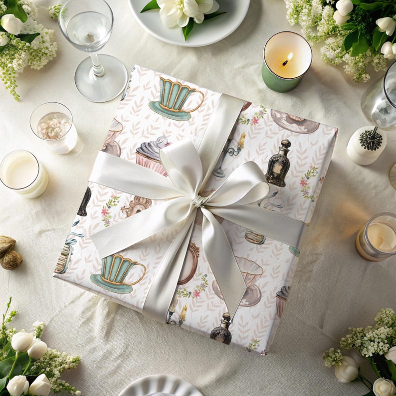 vintage tea party wrapping paper featuring teacups, cupcakes, perfume bottles and keys, wrapped with taupe ribbon, ideal for elegant gifts