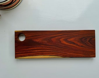 Small distinctive cocobolo charcuterie/presentation/serving board.