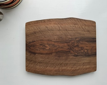 Small double live edge figured curly walnut charcuterie/presentation/serving board.