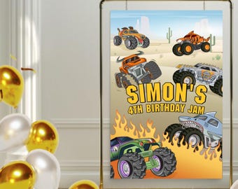 May include: A birthday party backdrop featuring a cartoon monster truck theme. The backdrop is orange and yellow with flames and four monster trucks. The text "Simon's 4th Birthday Jam" is printed in yellow on the backdrop.