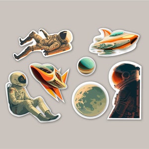 May include: A set of five space-themed stickers featuring astronauts, spaceships, and planets. The stickers are white with a black outline and feature colourful illustrations.