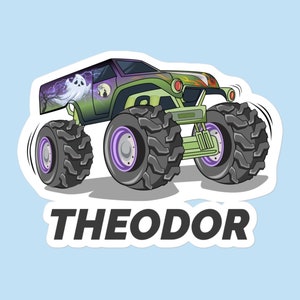 May include: A green monster truck with a ghost and lightning bolt design. The truck has large black tires with purple rims and the words "THEODOR" are printed on the bottom of the sticker.
