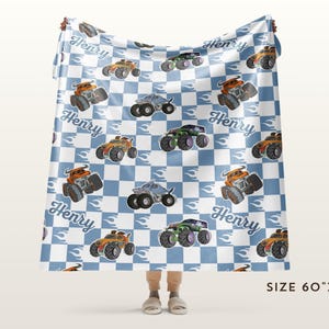 May include: A blue and white checkered fleece blanket with a repeating pattern of monster trucks, flames, and the name "Henry". The blanket is 60 inches by 80 inches.