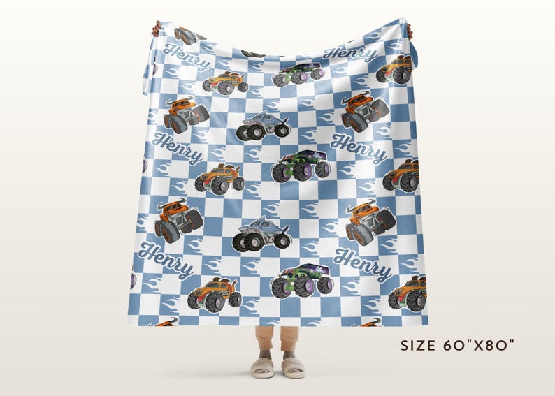 May include: A blue and white checkered fleece blanket with a repeating pattern of monster trucks, flames, and the name "Henry". The blanket is 60 inches by 80 inches.