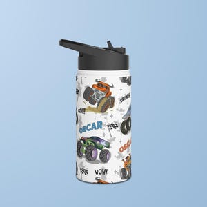 May include: White insulated water bottle with a black lid and a colourful design featuring monster trucks, the words "Oscar", "Go!!!", "Wow!" and "Crunch!"