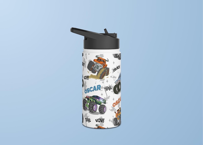 May include: White insulated water bottle with a black lid and a colourful design featuring monster trucks, the words "Oscar", "Go!!!", "Wow!" and "Crunch!"