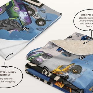 May include: A stack of monster truck blankets. The top blanket has a blue background with monster trucks and the word "GO!!!". The blankets have a velvety microplush side and a fluffy sherpa fleece side.