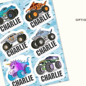 May include: A sheet of stickers featuring cartoon monster trucks in various designs, including a shark, tiger, and unicorn. Each sticker has the name "CHARLIE" in bold, white letters on a black background. The background is light blue with a repeating pattern.
