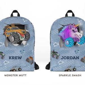 May include: Two blue backpacks with black straps. One features a monster truck design with the name "KREW" and the text "MONSTER MUTT". The other backpack has a unicorn monster truck design with the name "JORDAN" and the text "SPARKLE SMASH".