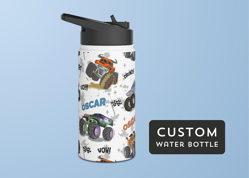 May include: White stainless steel water bottle with a black lid and a colourful monster truck design. The bottle has the name "Oscar" printed on it and the words "Go!!!", "Crunck", "Wow!" and "Oscar" printed on it.