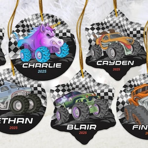 May include: Set of personalized monster truck ornaments. Each ornament features a unique monster truck design with a name and the year 2025. The ornaments have a black and white checkered background and gold hanging strings.