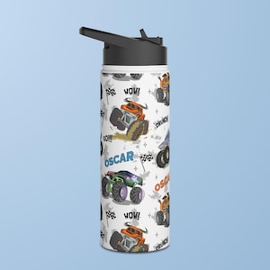 May include: White insulated water bottle with a black lid and a colourful pattern of monster trucks, the words "WOW!" and "OSCAR" and the phrase "CRUNCH!"