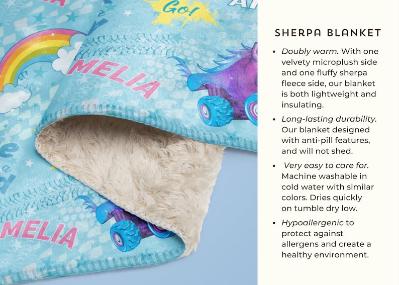 May include: A blue and white sherpa blanket featuring a colourful monster truck design and the text "MELIA" printed on it. The blanket is soft and fluffy, ideal for keeping warm on chilly evenings.