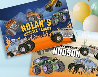 May include: Two colourful birthday cards featuring monster trucks. One card says "Nolan's Monster Trucks" with various monster truck illustrations. The other card says "Happy Birthday Hudson" with monster truck graphics.