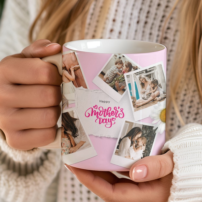 May include: A pink ceramic mug featuring a collage of photos of mothers and children. The mug has a white rim and handle. The text "Happy Mother's Day" is written in pink cursive on the mug.