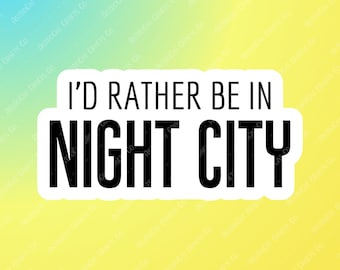 May include: White sticker with black text that reads "I'd rather be in Night City".