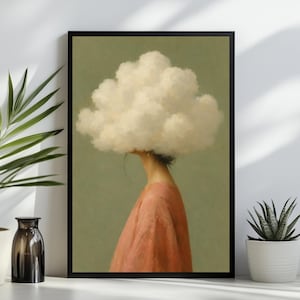 May include: A framed wall art print featuring a profile view of a figure with a large, fluffy white cloud replacing their head. The figure wears a solid peach-colored garment against a muted olive green background, presented in a black frame.