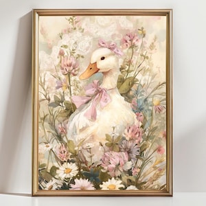 Puede incluir: Una impresi&oacute;n en acuarela enmarcada que presenta un pato blanco adornado con lazos rosas, en medio de un campo de flores silvestres. La obra de arte muestra una paleta de colores suaves de crema, rosa y verde, con un marco dorado. El tema general es una escena pastoral caprichosa.