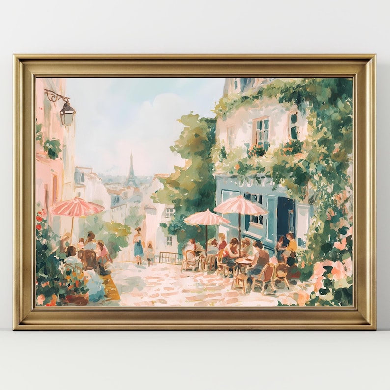 May include: A framed painting of a Parisian street scene, featuring cafes, people, and the Eiffel Tower. The artwork uses soft colours, pink parasols, and a gold frame, creating a romantic atmosphere.