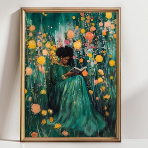 May include: A framed art print depicts a person in a long green dress reading a book amidst a vibrant garden of yellow, orange, and pink flowers. The artwork has a gold frame and a serene, dreamlike quality.