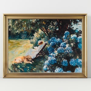 May include: A framed painting depicts a serene garden scene. A person in a white dress and hat reclines in a chair, reading. A golden retriever rests nearby. Lush blue hydrangeas and green foliage surround them, with a gold frame.