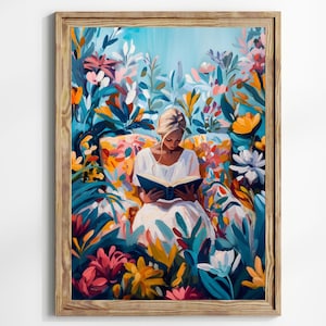 May include: A framed art print depicts a person reading a book amidst a vibrant garden. The artwork features a woman in a white dress, surrounded by colorful flowers and foliage in shades of blue, orange, pink, and yellow. The frame is made of wood.