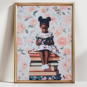 May include: A framed print featuring a young girl reading a book while seated atop a stack of books. The girl wears a floral dress and the book has a floral cover. The background is a floral pattern in shades of pink and white.
