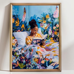 May include: A framed art print depicts a person reading in bed, surrounded by colorful flowers. The person is wearing a yellow top and is reading a book with a floral cover. The bedspread and background are filled with vibrant floral patterns in shades of blue, orange, and pink.
