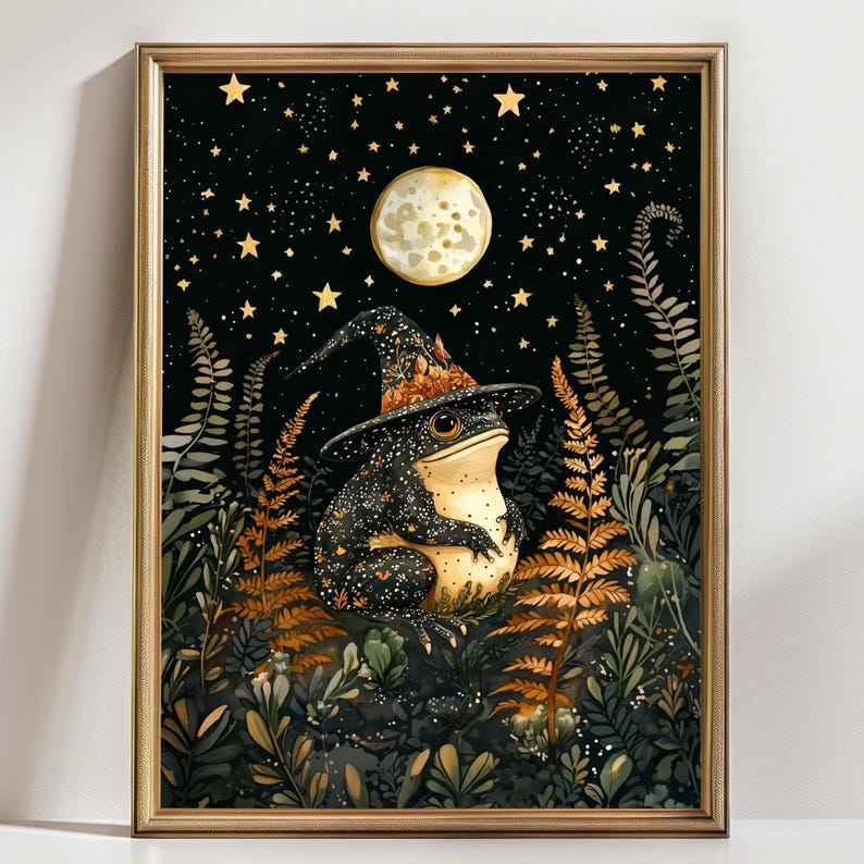 May include: A black frog wearing a witch's hat with gold stars sits in a forest with ferns and a full moon in the background.