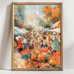 May include: A framed watercolor painting depicts a bustling outdoor market scene. The artwork features vibrant colors, including orange pumpkins, red flowers, and figures in hats and dresses. The scene is set under white canopies and orange umbrellas, with a golden frame.