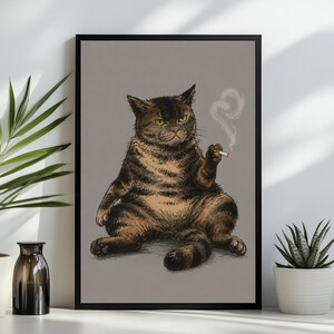 May include: A framed wall art print featuring a brown and black tabby cat sitting in a relaxed posture against a solid gray background. The cat has yellow eyes and is holding a lit cigarette in one paw, with a thin trail of white smoke rising upward.