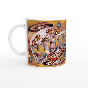 May include: A white ceramic mug with a black handle and the text "But First, Coffee" in a black, handwritten-style font. The mug is on a white surface.