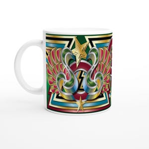 May include: White ceramic mug with a vibrant design of stylized wings, stars, and geometric shapes in red, gold, green, and blue. The mug has a curved handle and a glossy finish, perfect for tea or coffee.