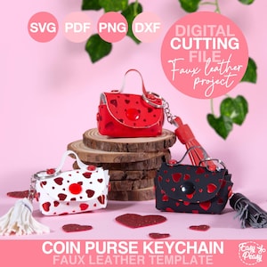 May include: Three faux leather coin purse keychains in red, white, and black, each with a heart pattern. The red purse sits on a wooden slice. The image includes the text "DIGITAL CUTTING FILE Faux leather project" and "COIN PURSE KEYCHAIN FAUX LEATHER TEMPLATE."