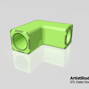 May include: A lime green, L-shaped object with rounded corners and circular openings at each end. The object has a transparent appearance, with a subtle reflection visible below. The text "ArtistStudio3D STL-Datei Download" is in the bottom right corner.