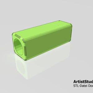 May include: A lime green, rectangular 3D-rendered object with rounded corners and a circular opening on one end. The object is set against a light gray background with a subtle reflection. Text at the bottom reads "ArtistStudio3D STL-Datei Download".