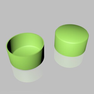 May include: Two green plastic containers, one is a cylinder and the other is a bowl.
