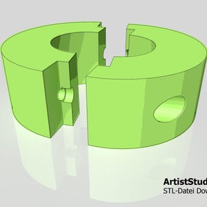 May include: A green plastic split ring with a hole in the center. The ring is designed to be used as a connector for two pieces of material.