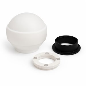May include: A white spherical light globe with a smooth matte finish, accompanied by a black circular mounting ring featuring small screw holes and a white circular ring insert embedded with four small silver-colored circular magnets.