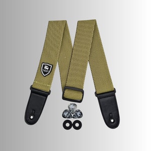 May include: A yellow and black guitar strap with a black leather end and a black logo that says "Premier Music". The strap comes with three black guitar picks and two black strap buttons.