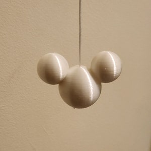 May include: White plastic light pull shaped like Mickey Mouse's head.